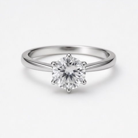 Source product photo of a silver six-prong ring with a round clear stone